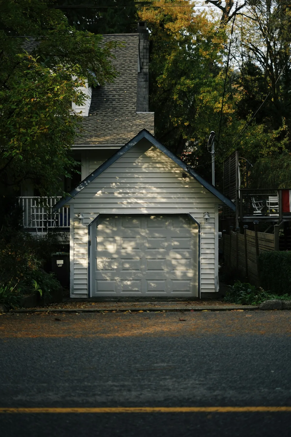 Detached one-car garage in front of a house
