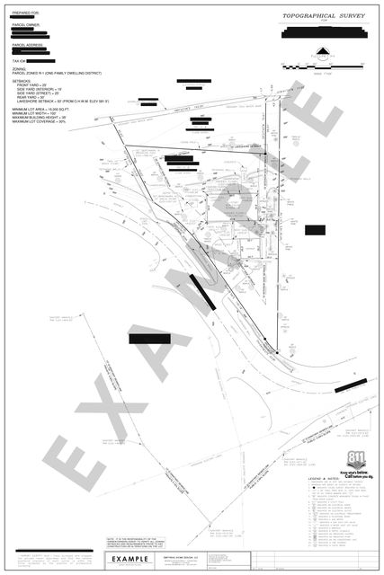 Topographic survey: Contours, spot elevations, trees, and improvements around a house and garage.